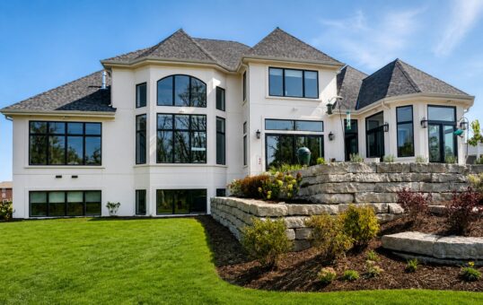 Sanctuary custom home in Menomonee Falls by Kingfogl – exterior rear elevation and stone terrace