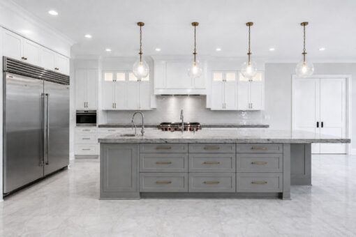 Sanctuary custom home in Menomonee Falls by Kingfogl – kitchen island and refrigerator view 1