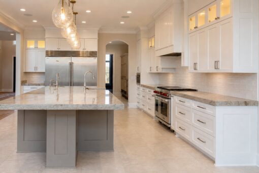 Sanctuary custom home in Menomonee Falls by Kingfogl – kitchen island toward range