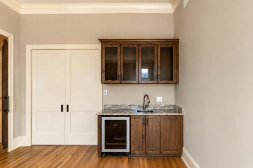 Sanctuary custom home in Menomonee Falls by Kingfogl – hearth room wet bar