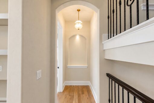 Sanctuary custom home in Menomonee Falls by Kingfogl – hallway niche and staircase