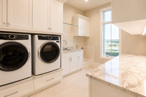 Sanctuary custom home in Menomonee Falls by Kingfogl – laundry room view 1