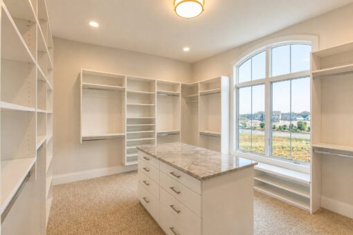 Sanctuary custom home in Menomonee Falls by Kingfogl – primary closet with arched window