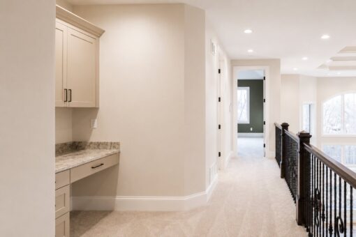 Sanctuary custom home in Menomonee Falls by Kingfogl – 2nd floor hallway with built-in desk