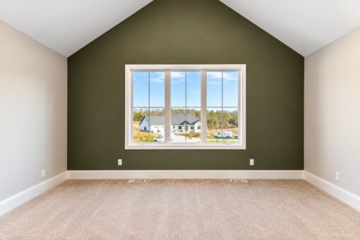 Sanctuary custom home in Menomonee Falls by Kingfogl – 2nd floor vaulted bedroom with green accent wall