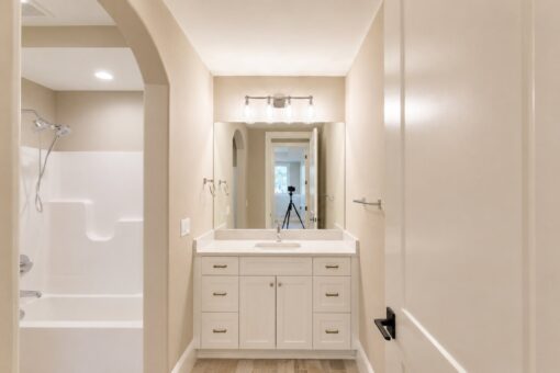 Sanctuary custom home in Menomonee Falls by Kingfogl – 2nd floor bathroom tub-shower and vanity