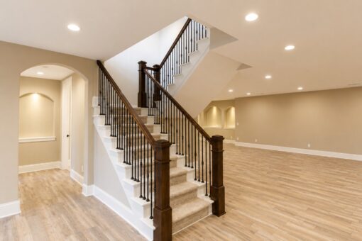 Sanctuary custom home in Menomonee Falls by Kingfogl – basement staircase and arched hallway