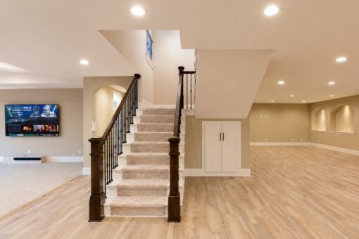 Sanctuary custom home in Menomonee Falls by Kingfogl – basement staircase and media wall