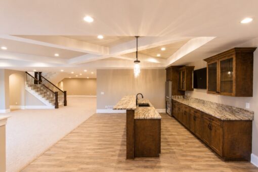 Sanctuary custom home in Menomonee Falls by Kingfogl – basement bar kitchen and recreation room view 1