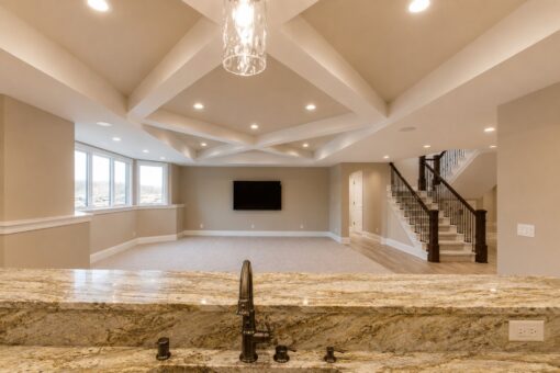 Sanctuary custom home in Menomonee Falls by Kingfogl – basement family room from bar