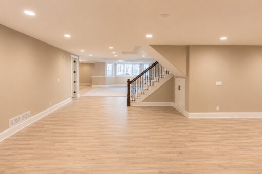 Sanctuary custom home in Menomonee Falls by Kingfogl – basement recreation room and staircase view 2