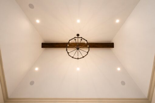 Sanctuary custom home in Menomonee Falls by Kingfogl – vaulted ceiling with beam and chandelier
