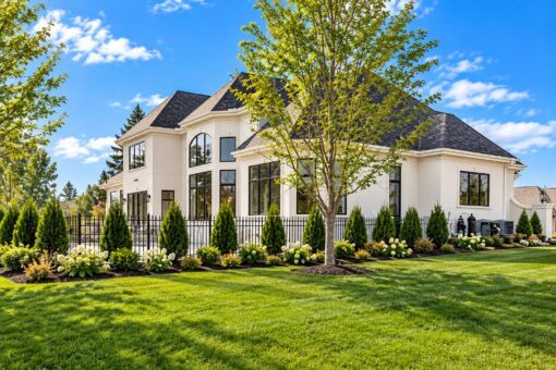 Settlers Circle custom home in Sheboygan Falls by Kingfogl – rear elevation with mature trees, view 2