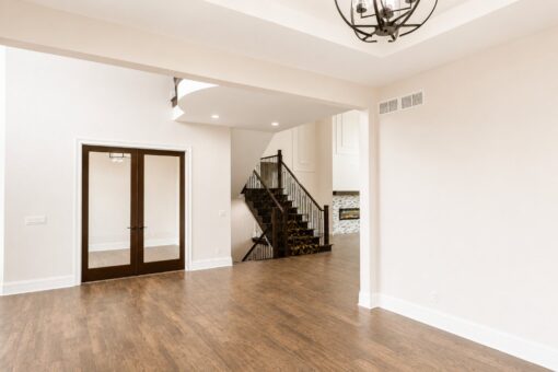 Turnberry custom home in New Berlin by Kingfogl – foyer office french doors and staircase