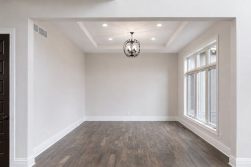 Turnberry custom home in New Berlin by Kingfogl – dining room tray ceiling and chandelier