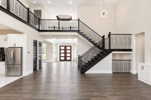 Turnberry custom home in New Berlin by Kingfogl – great room staircase and front entry wide