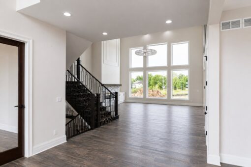 Turnberry custom home in New Berlin by Kingfogl – great room staircase and window wall