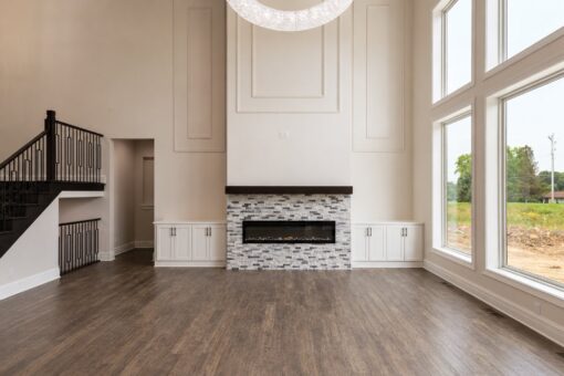 Turnberry custom home in New Berlin by Kingfogl – great room fireplace and window wall wide