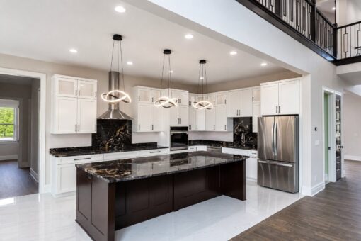 Turnberry custom home in New Berlin by Kingfogl – kitchen range wall and island front view