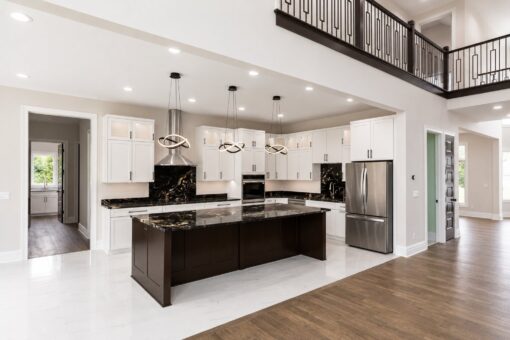 Turnberry custom home in New Berlin by Kingfogl – kitchen island and balcony above