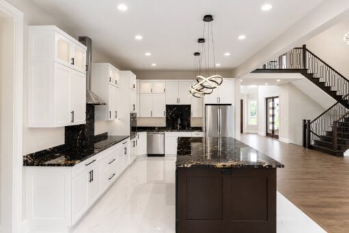 Turnberry custom home in New Berlin by Kingfogl – kitchen range wall and staircase
