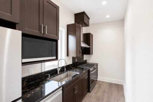 Turnberry custom home in New Berlin by Kingfogl – prep kitchen range and sink