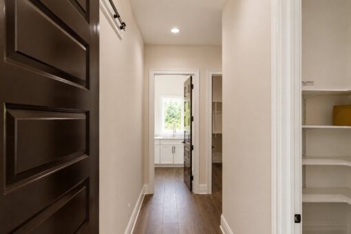 Turnberry custom home in New Berlin by Kingfogl – mudroom hallway to laundry