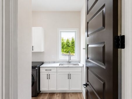 Turnberry custom home in New Berlin by Kingfogl – laundry room sink and cabinets