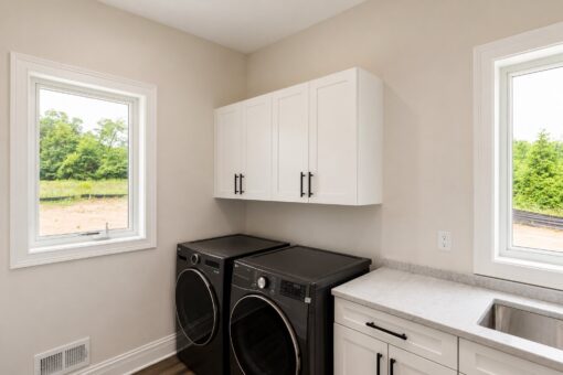 Turnberry custom home in New Berlin by Kingfogl – laundry room washer and dryer