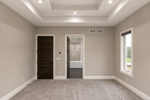 Turnberry custom home in New Berlin by Kingfogl – master bedroom toward bath and closet