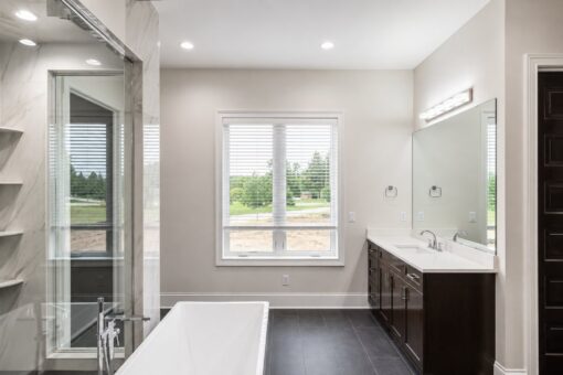 Turnberry custom home in New Berlin by Kingfogl – master bath tub and window view
