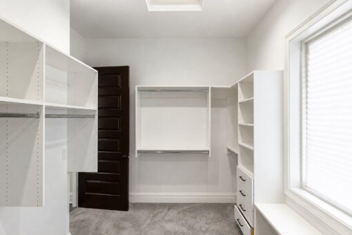 Turnberry custom home in New Berlin by Kingfogl – master closet island shelving