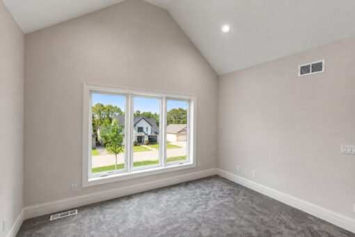 Turnberry custom home in New Berlin by Kingfogl – bedroom window wall and vaulted ceiling