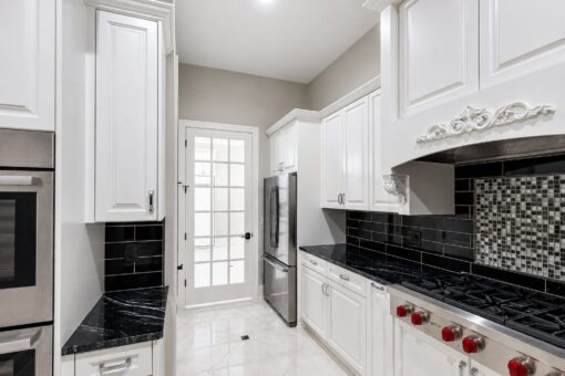 Vizzini custom home in Franklin by Kingfogl – 1st floor - kitchen range and refrigerator