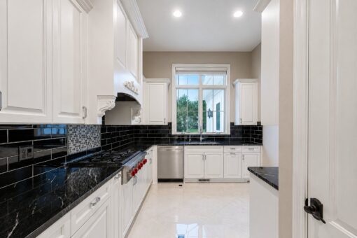 Vizzini custom home in Franklin by Kingfogl – 1st floor - kitchen range and sink
