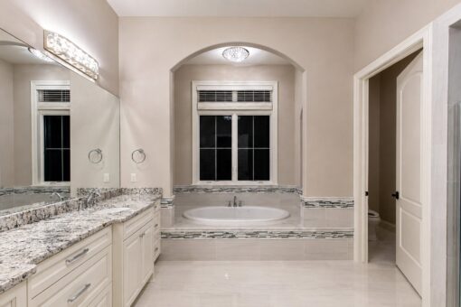 Vizzini custom home in Franklin by Kingfogl – 1st floor - primary bathroom tub and vanity