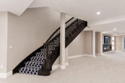 Vizzini custom home in Franklin by Kingfogl – basement - recreation room staircase and fireplace