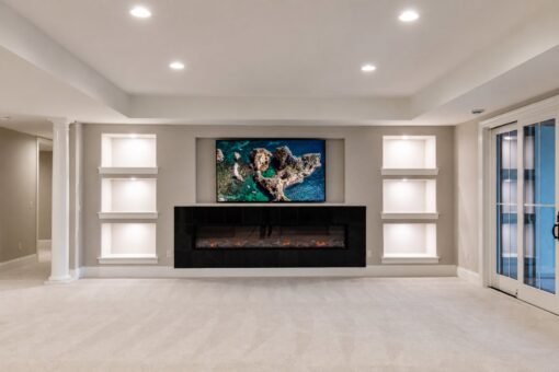 Vizzini custom home in Franklin by Kingfogl – basement - media room fireplace - front
