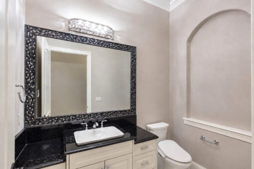 Vizzini custom home in Franklin by Kingfogl – basement - powder room