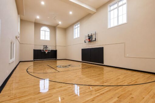Vizzini custom home in Franklin by Kingfogl – basement - basketball court - angle 1