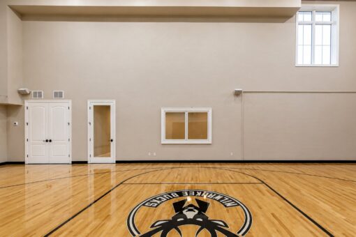 Vizzini custom home in Franklin by Kingfogl – basement - basketball court side wall