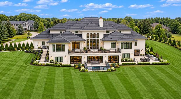 Vizzini custom home in Franklin by Kingfogl – rear elevation with wide lawn and patio