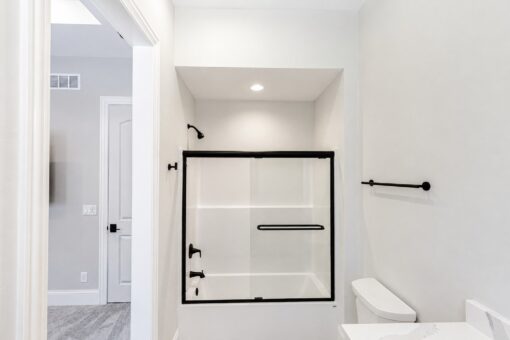 Apex bathroom with tub-shower and black fixtures