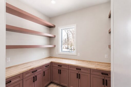 Apex butler's pantry with floating shelves and butcher block counters