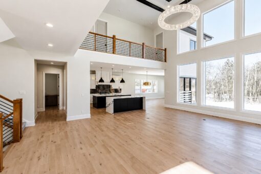 Apex great room with balcony and view to the kitchen