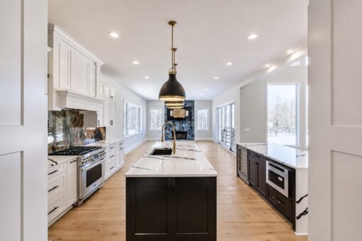 Apex kitchen with black island and professional range