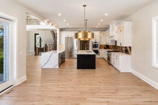 Apex kitchen with gold drum pendant and view to the staircase