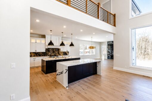 Apex kitchen with waterfall island and black pendants