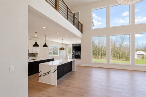 Apex kitchen with waterfall island and window wall