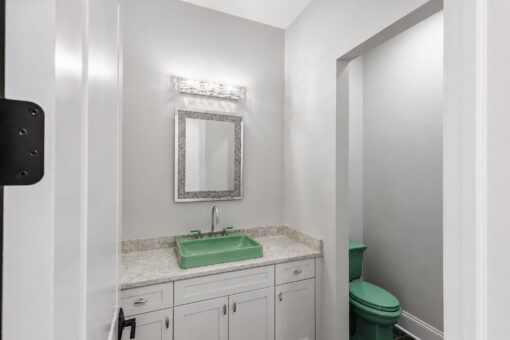 Apex powder room with green vessel sink